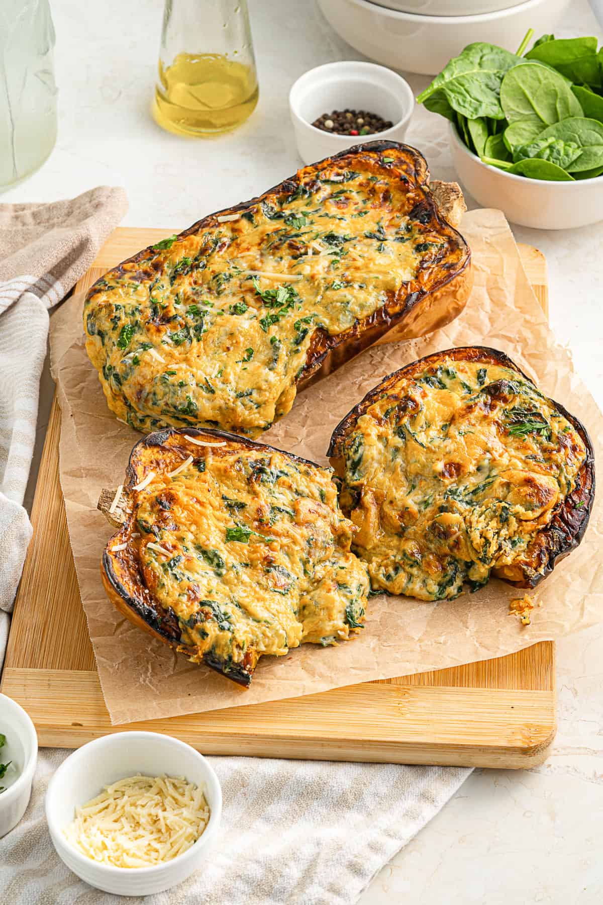 Cheese Stuffed Butternut Squash on a cutting board. 
