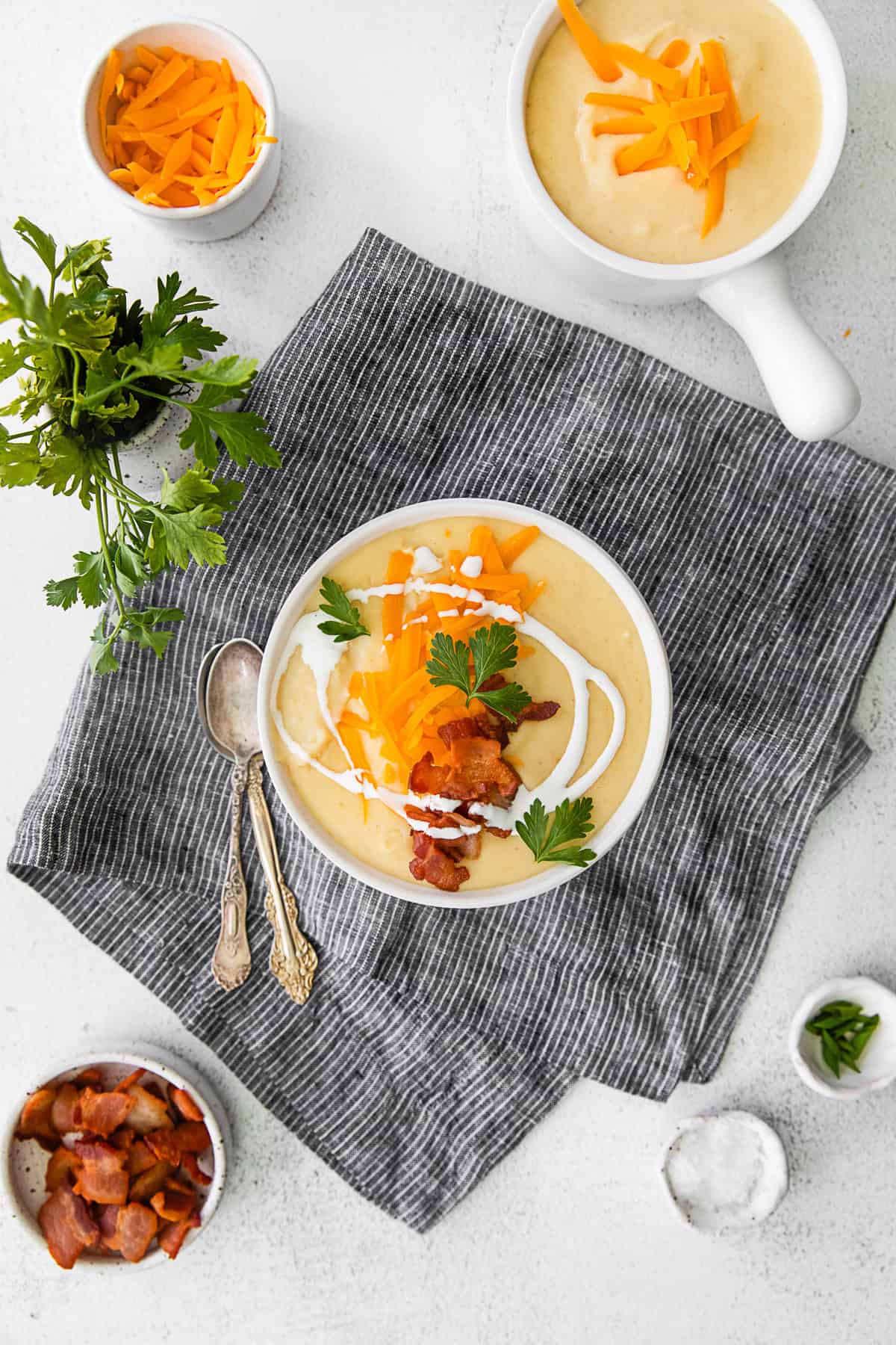 Instant Pot Loaded Potato Soup in a bowl topped with bacon. 