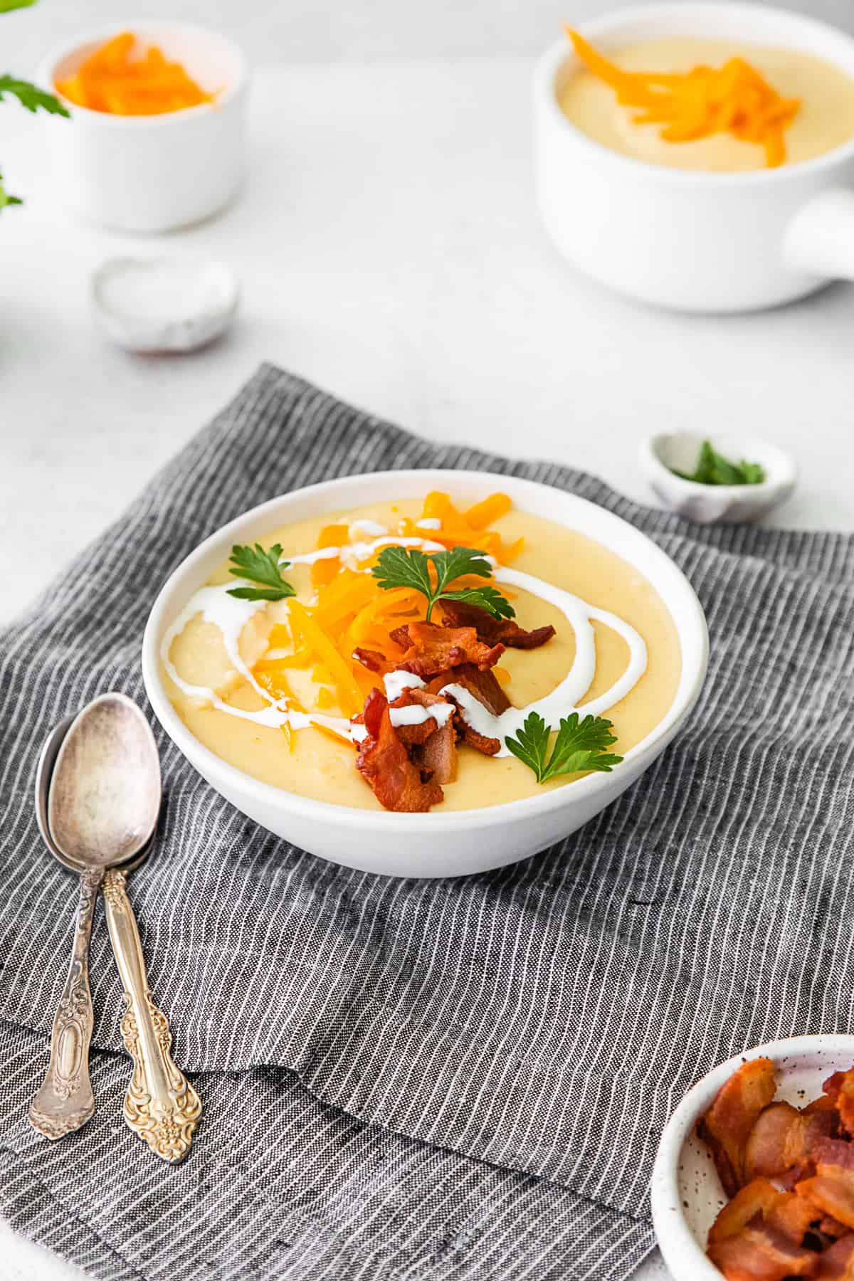 Instant Pot Loaded Potato Soup topped with bacon. 