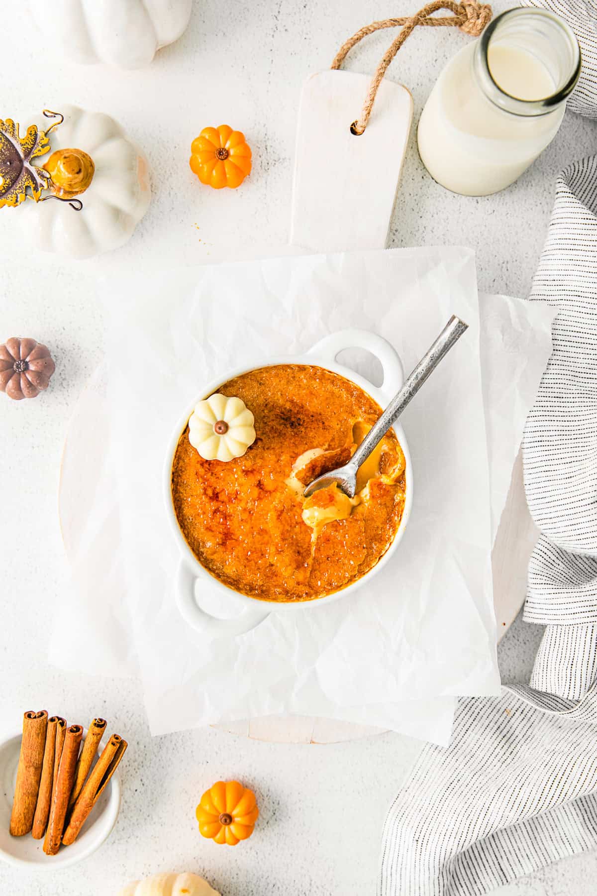 Pumpkin Creme Brulee with a spoon into the custard. 
