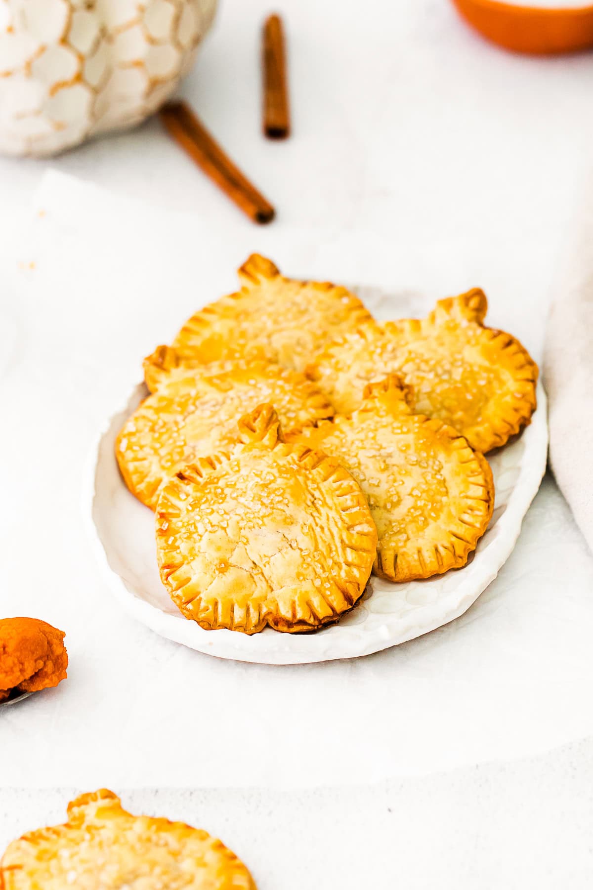 Pumpkin Hand Pies topped with coarse sugar. 