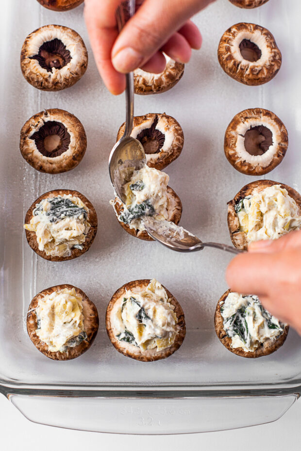 Stuffing mushrooms.