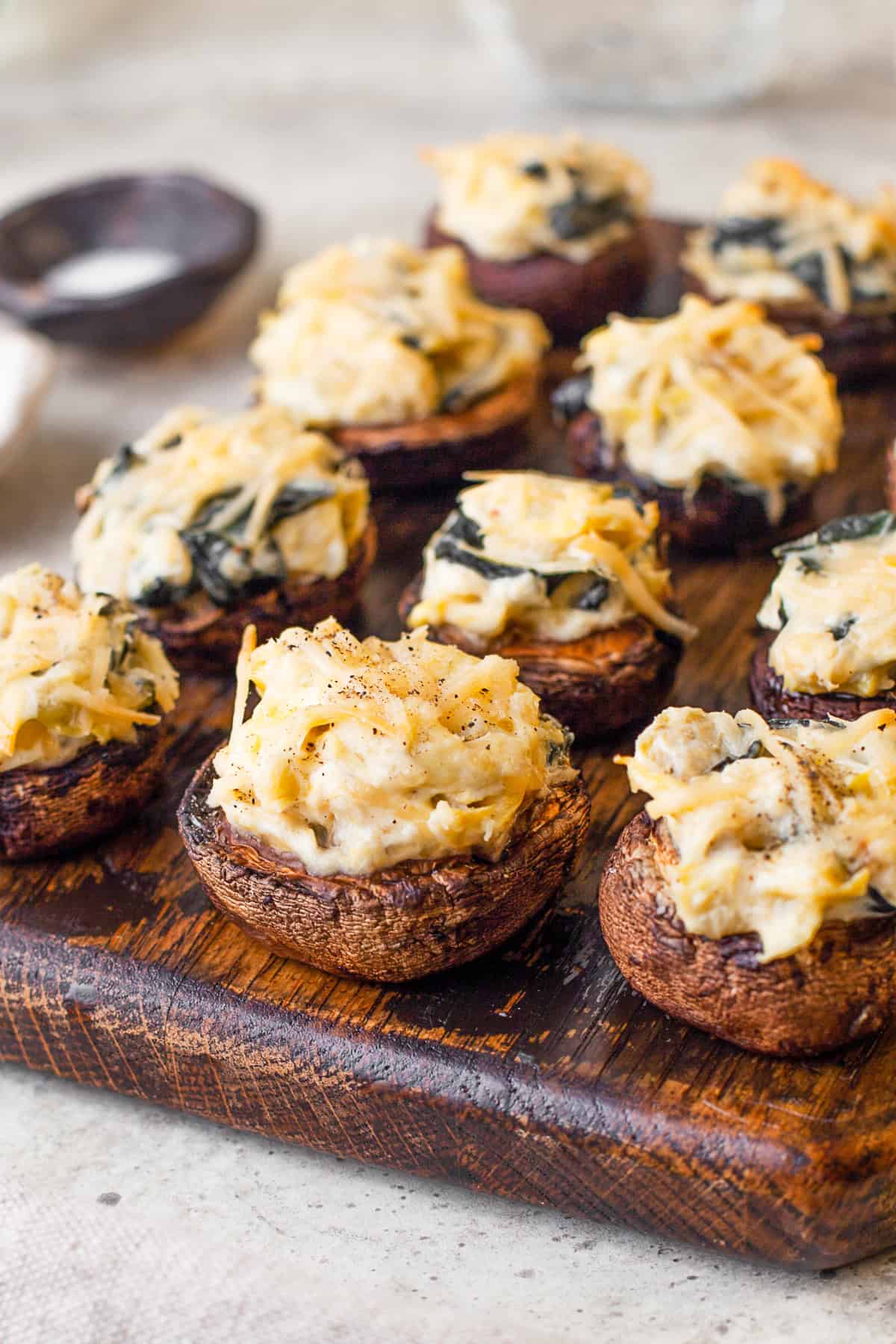 Spinach Artichoke Stuffed Mushrooms on a serving tray.