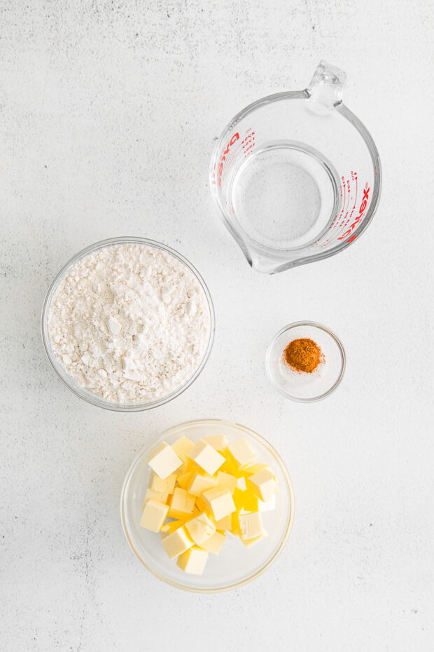 Ingredients to make food processor pie dough on a table. 