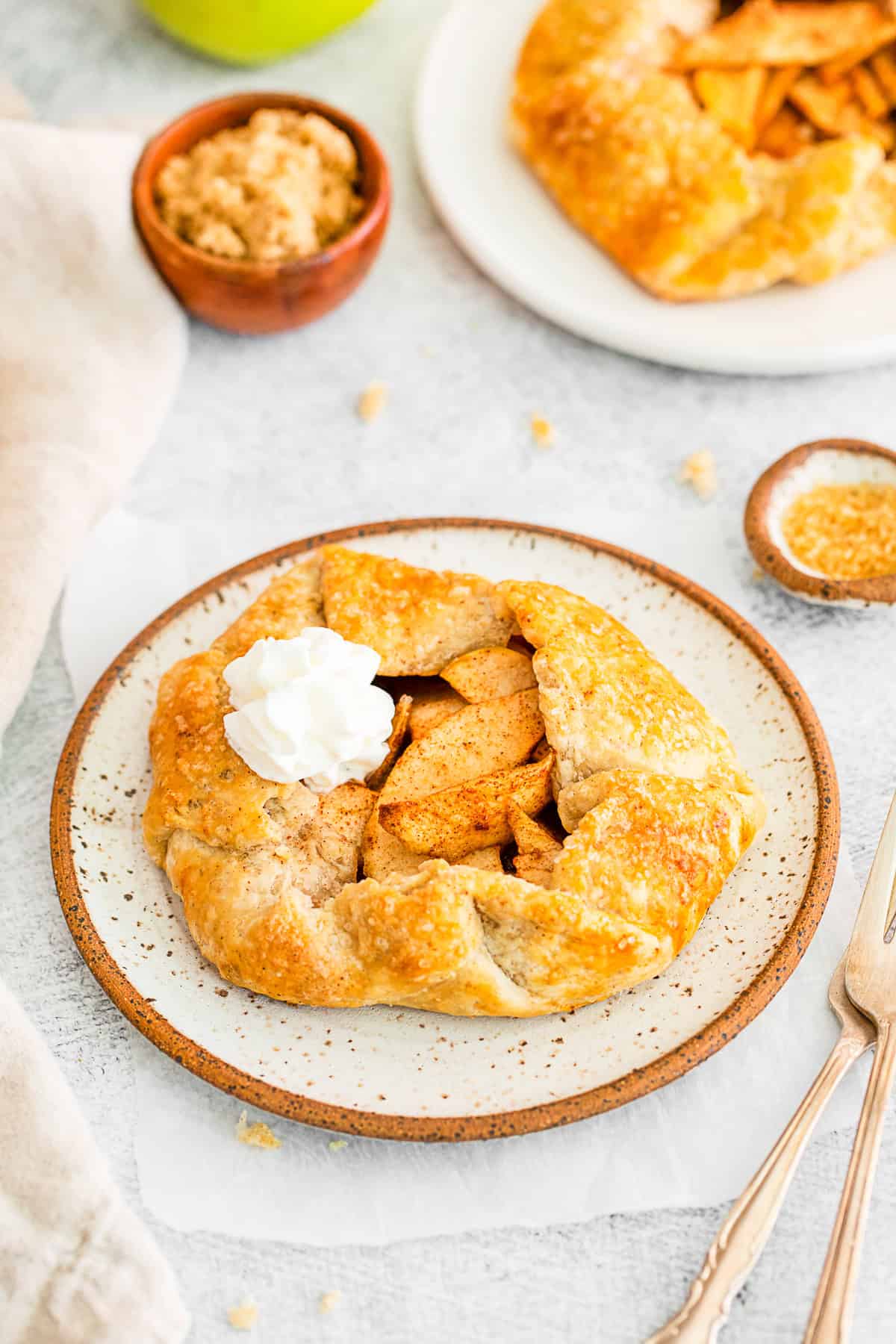 Apple Galette topped with whipped cream. 