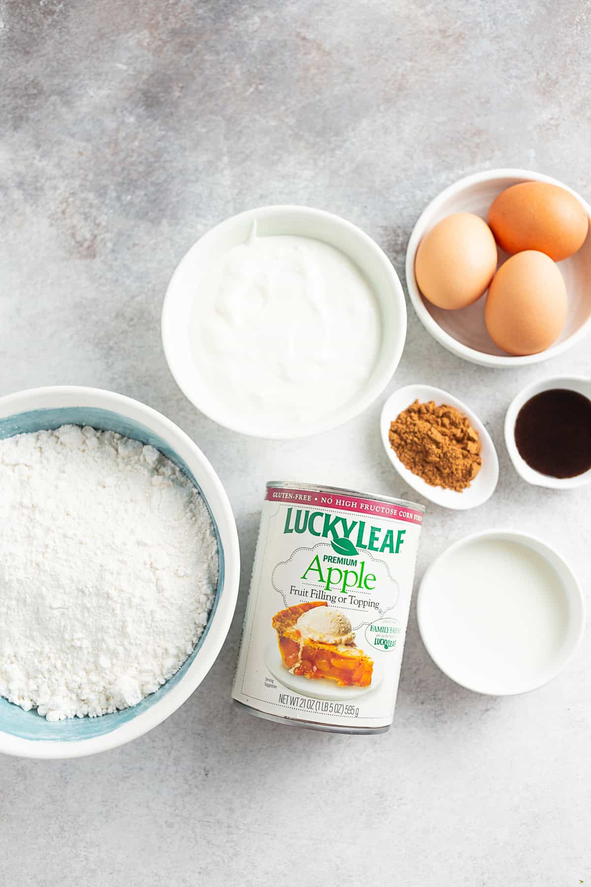 Ingredients to make Apple Pie Filling Coffee Cake on a table.