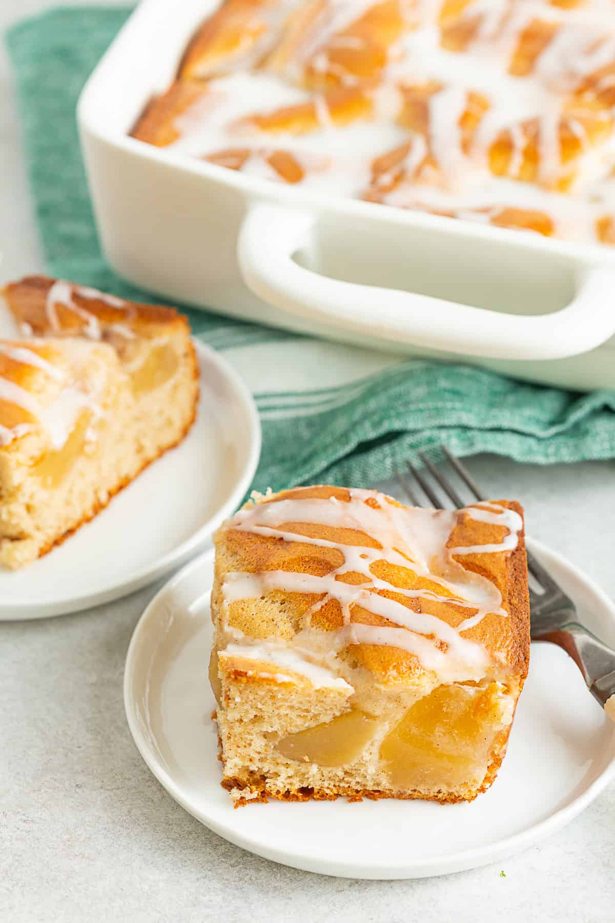 Apple Pie Filling Coffee Cake cut on a white plate.