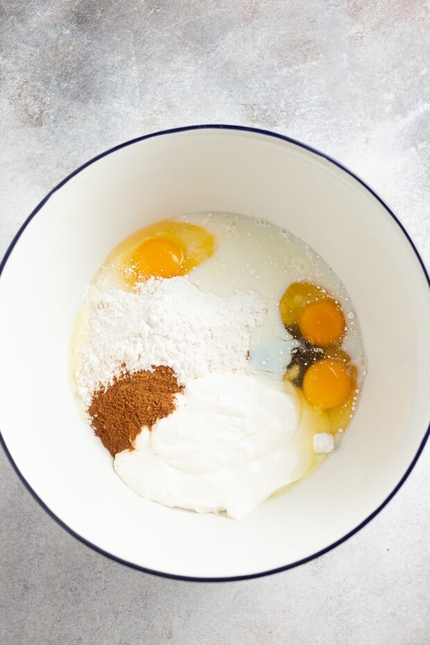 Cake mix and ingredients in a bowl.