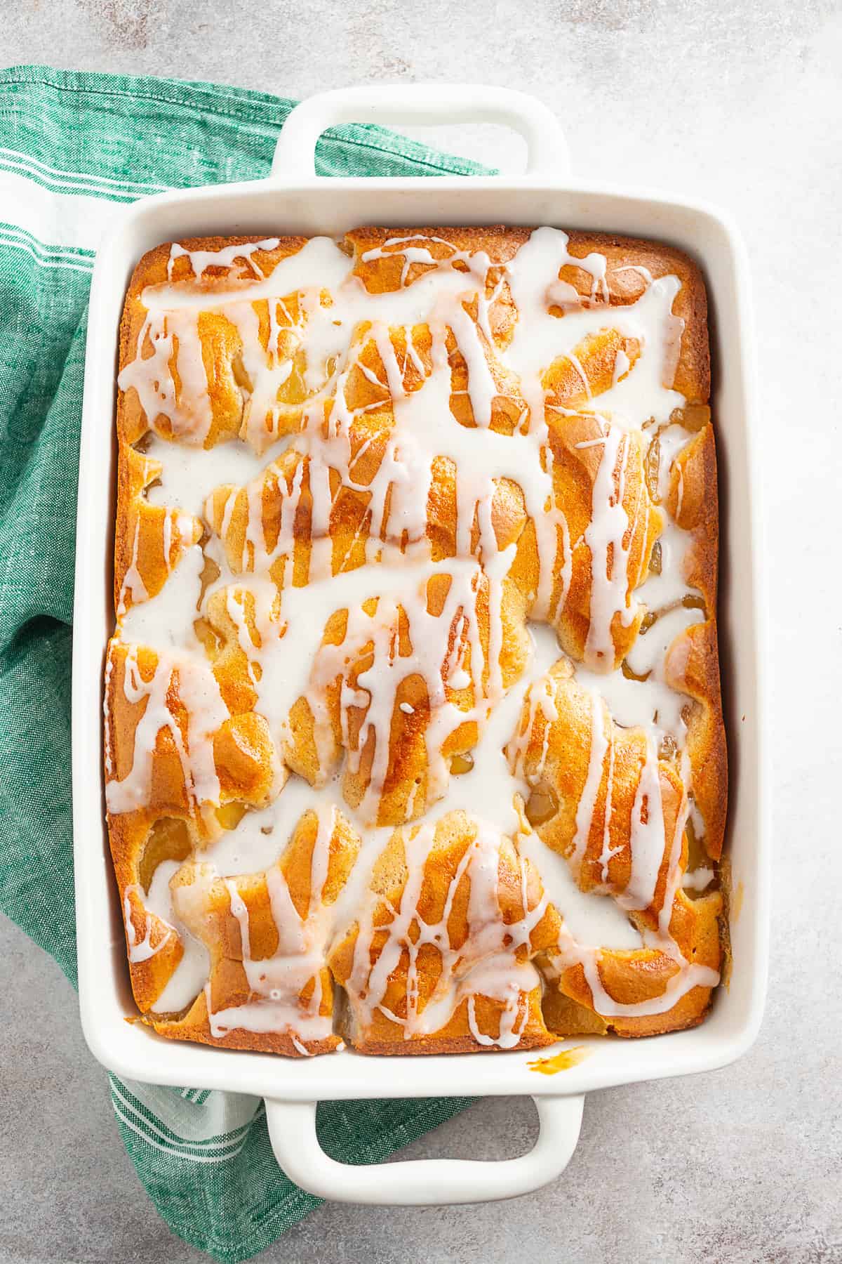 Apple Pie Filling Coffee Cake drizzled with a glaze.