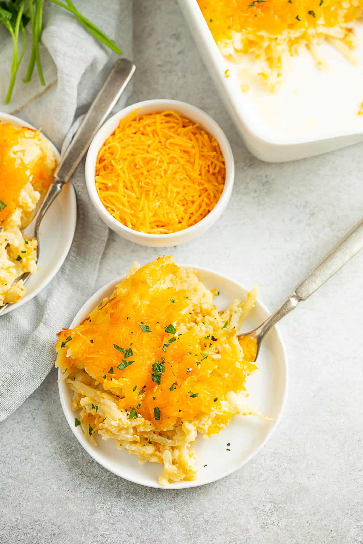 Cheesy Potatoes (Funeral Potatoes) on a small plate. 