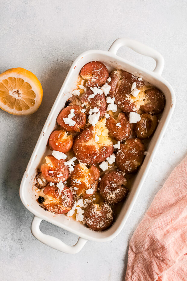Smashed potatoes with cheese on top unbaked. 