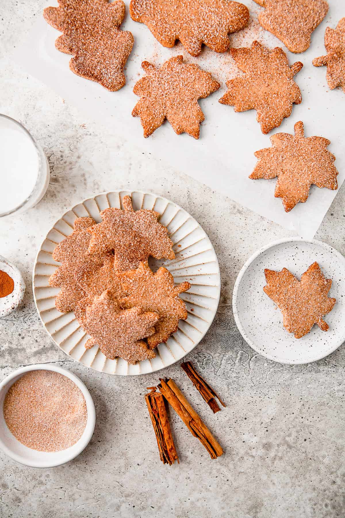Cinnamon Nut Cookies on a plate and on parchment paper. 