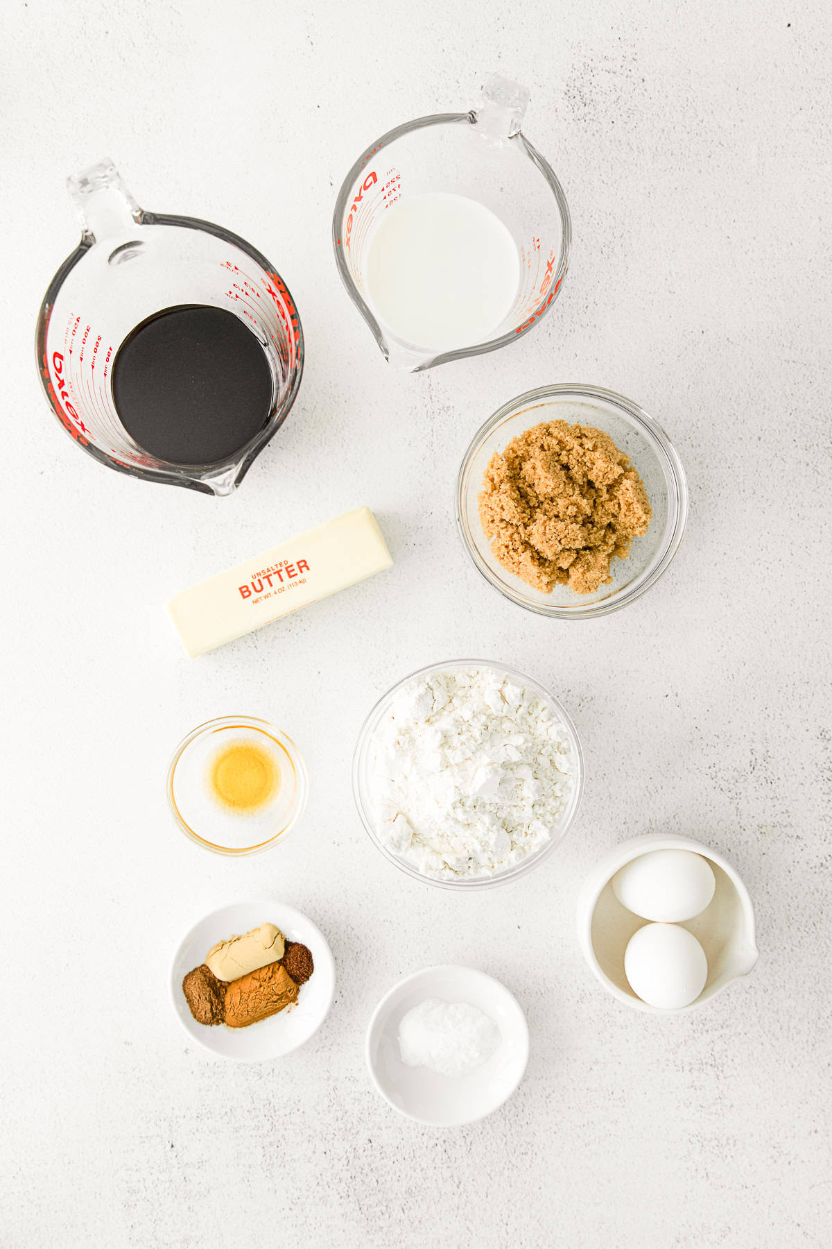 Ingredients to make Gingerbread Muffins on a table. 