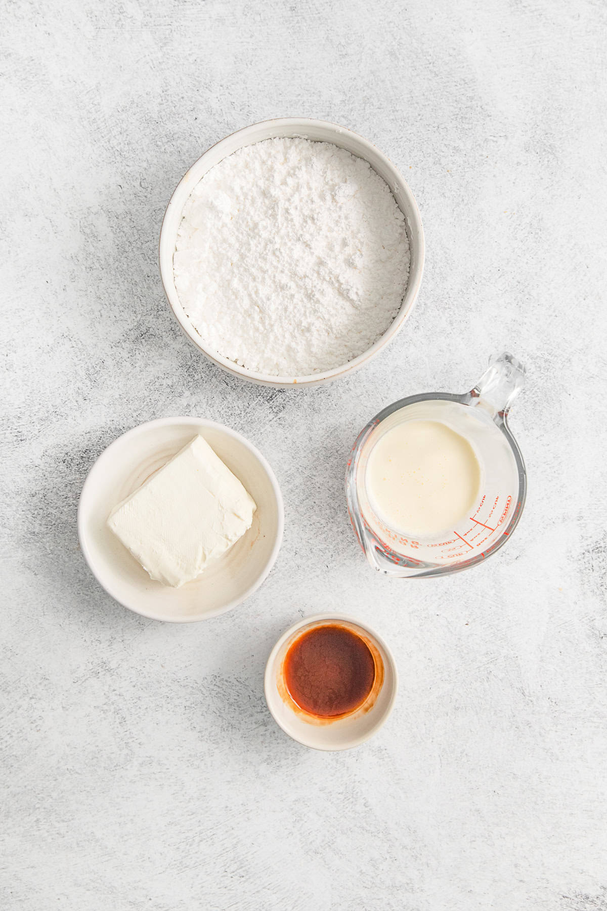 Creamy cream cheese frosting ingredients on a table.