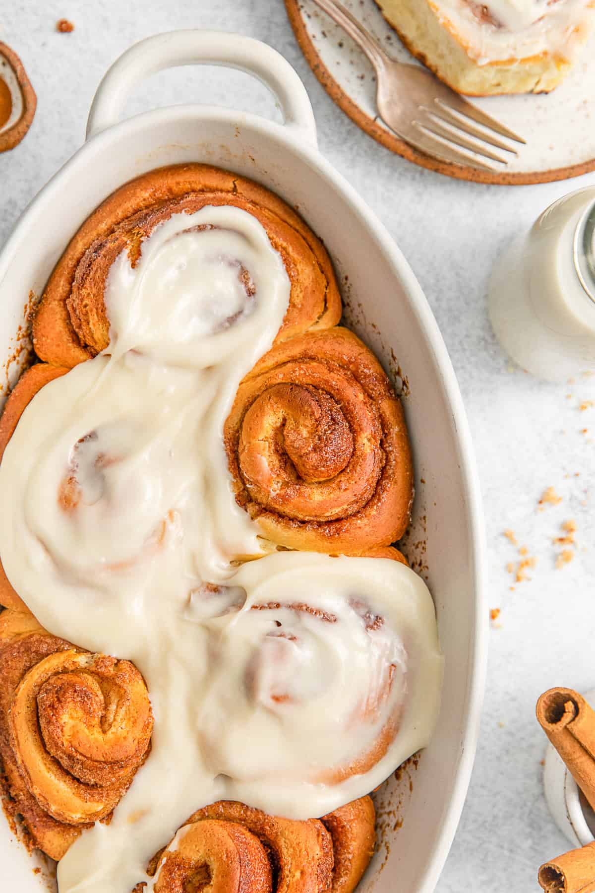 Homemade Cinnamon Rolls topped with cream cheese frosting.