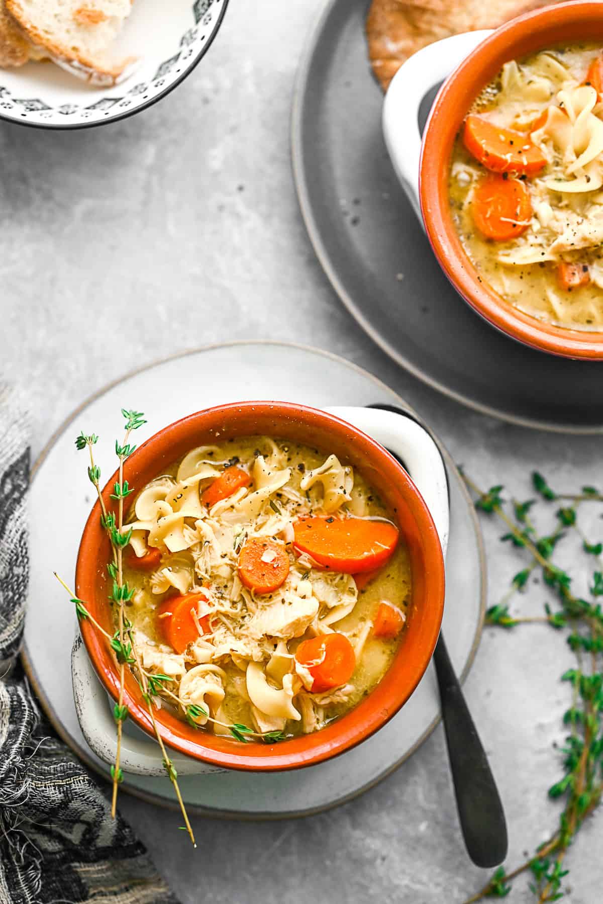 Leftover Turkey Noodle Soup in a small bowl with a spoon. 