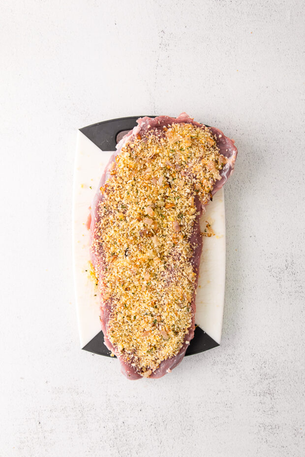Pork tenderloin sprinkled with herbed bread crumbs.