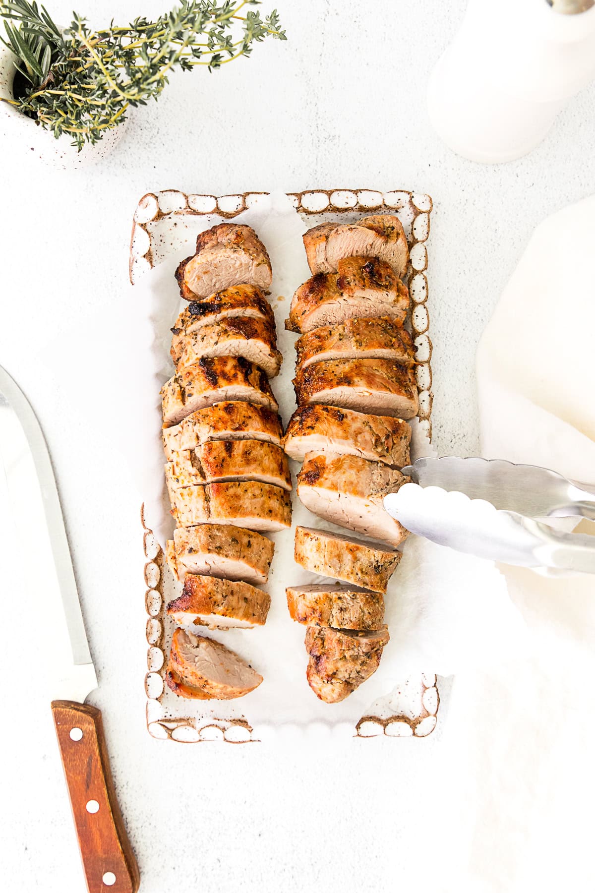 Air Fryer Pork Tenderloin on a platter sliced. 