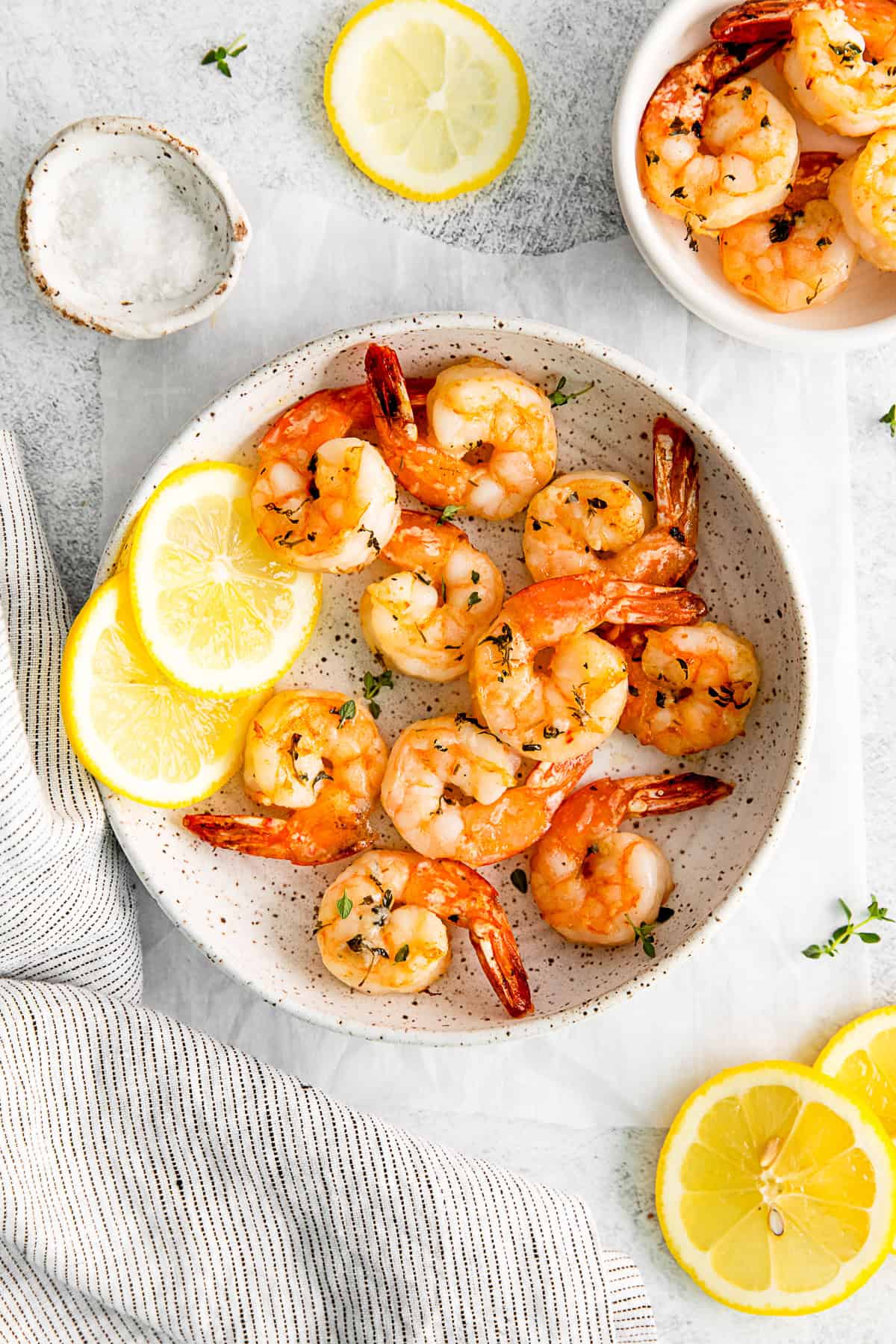Air Fryer Shrimp served with lemon slices.