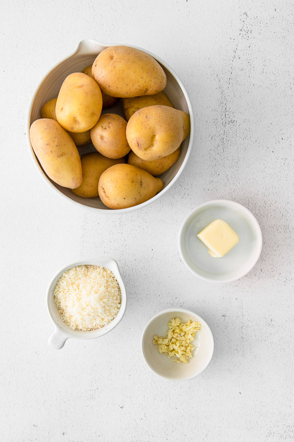 Ingredients to make Air Fryer Smashed Potatoes on a table. 
