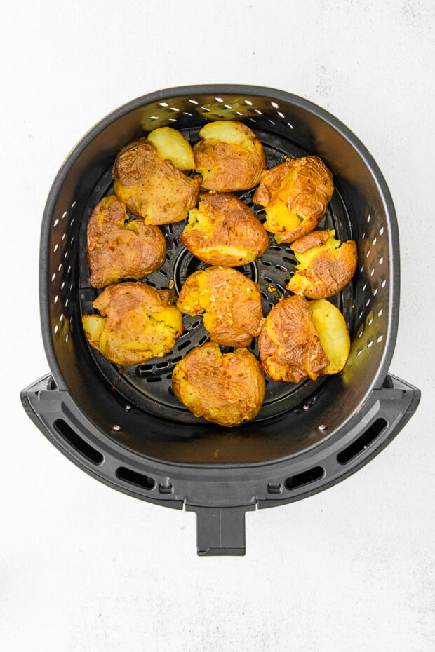 Air Fryer Smashed Potatoes in the basket. 