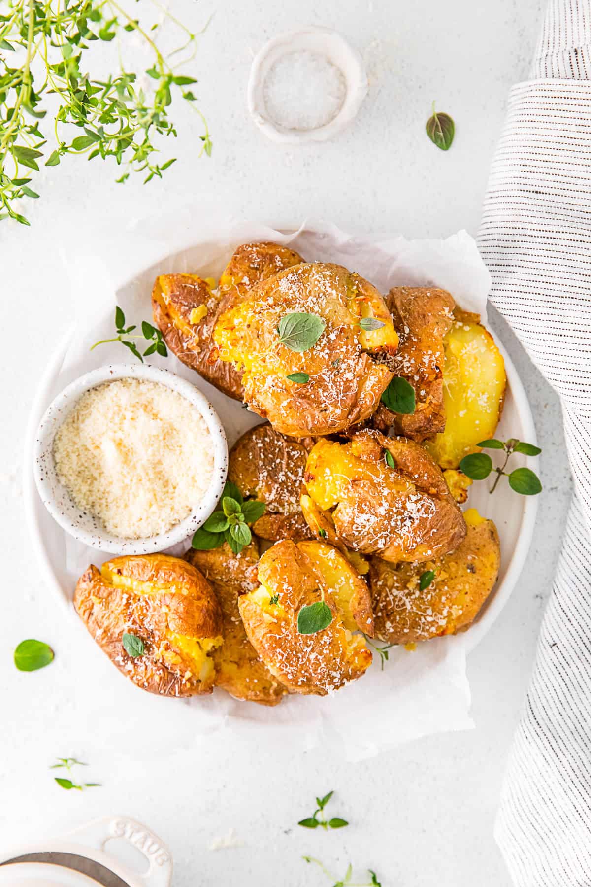 Air Fryer Smashed Potatoes on a white plate. 