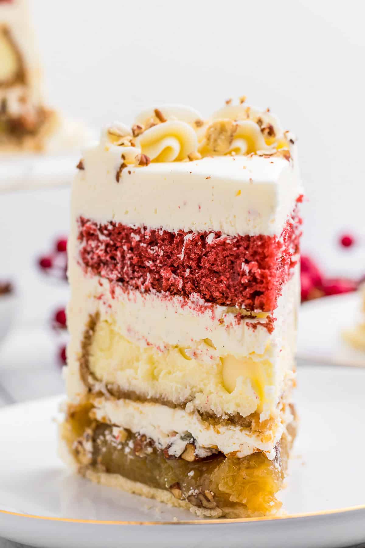 A slice of Christmas Piecaken topped with nuts. 
