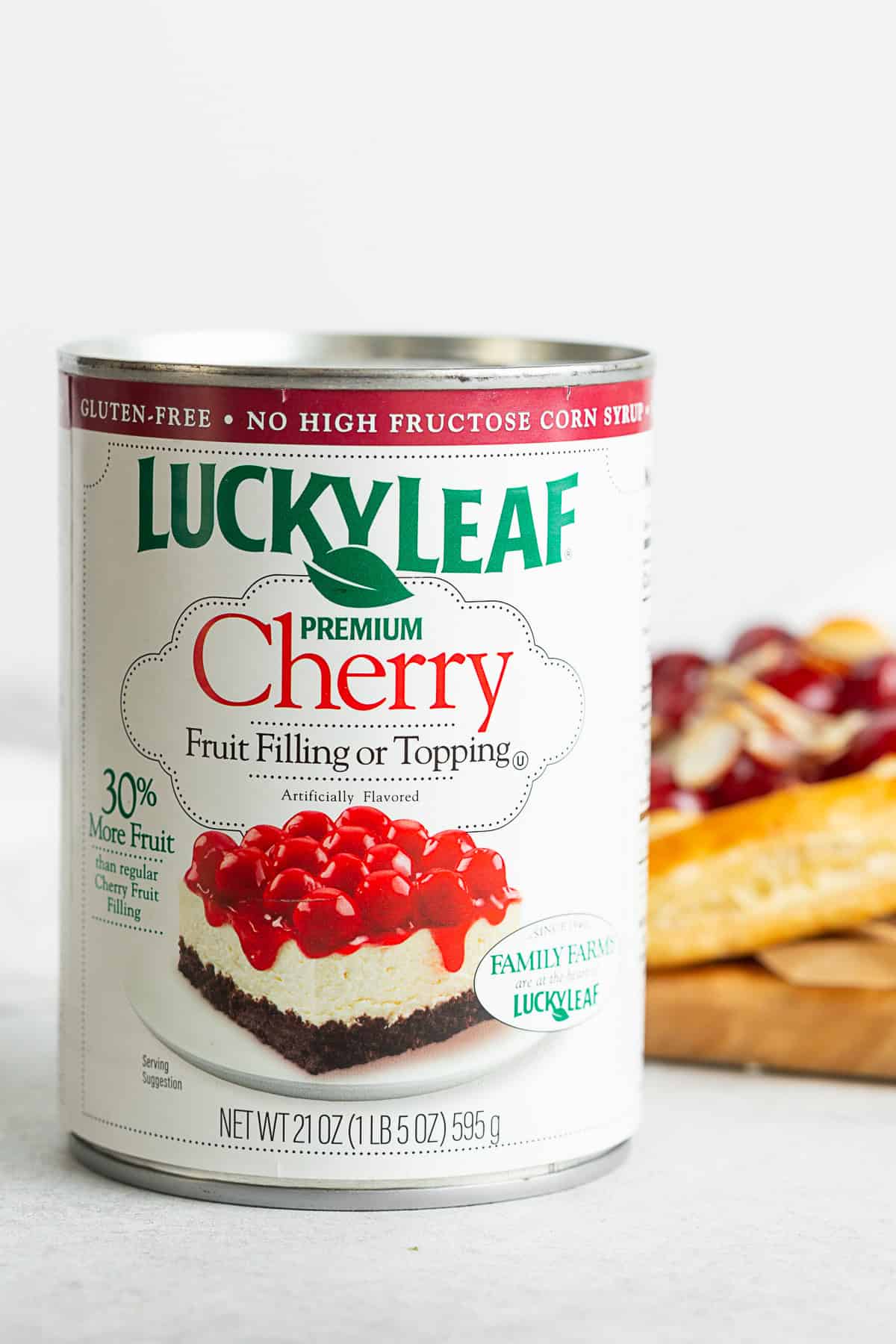 A can of cherry fruit filling on a table. 
