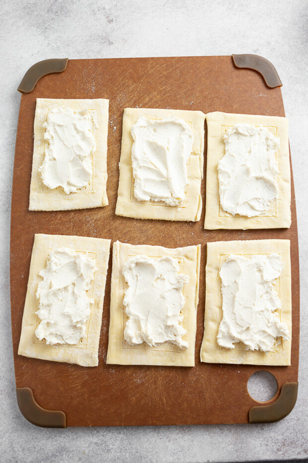 Uncooked Danish topped with cream cheese. 