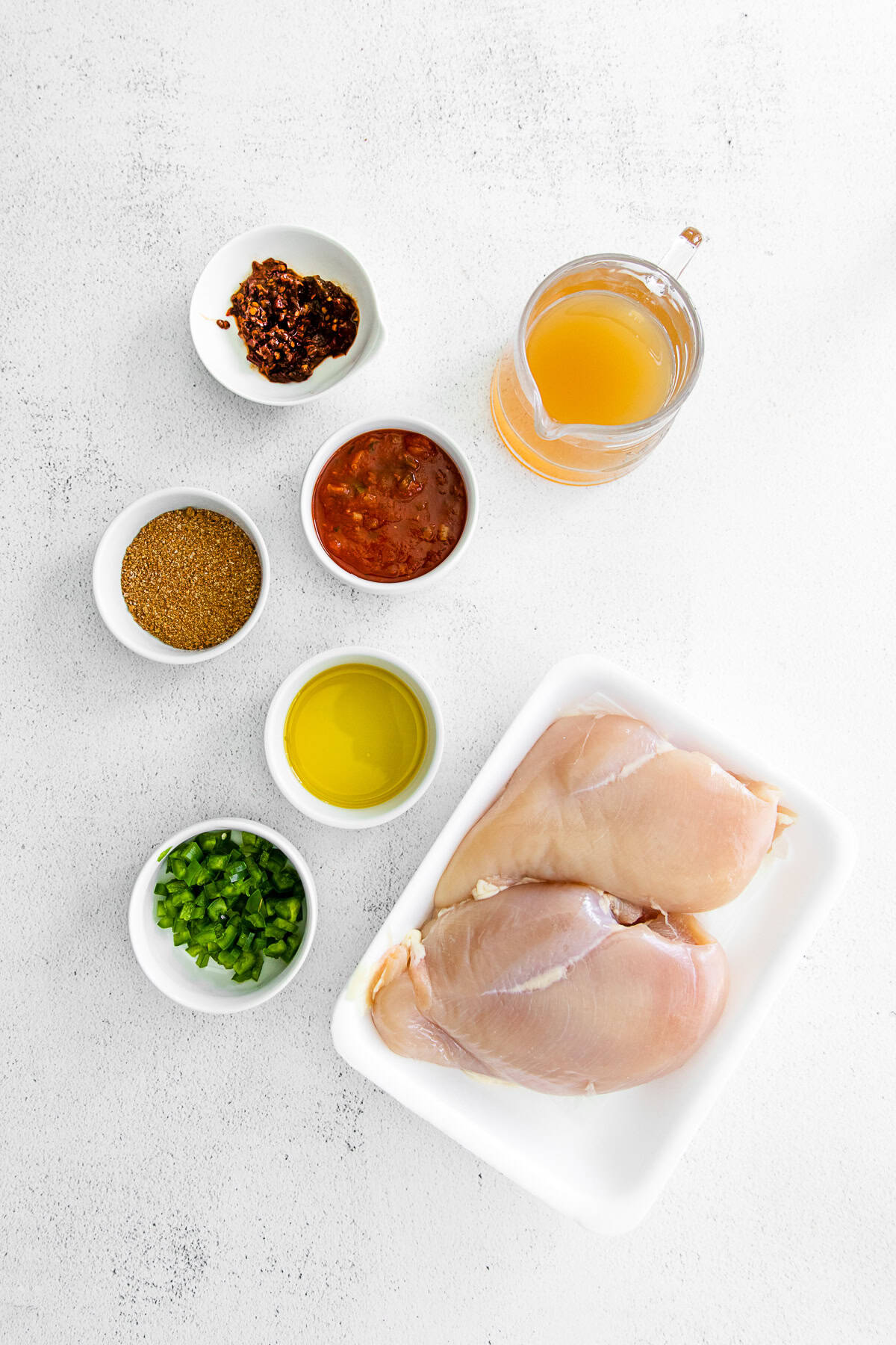 Instant Pot Chicken Tacos ingredients on a table. 