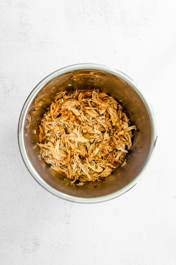 Shredded chicken in a pot. 