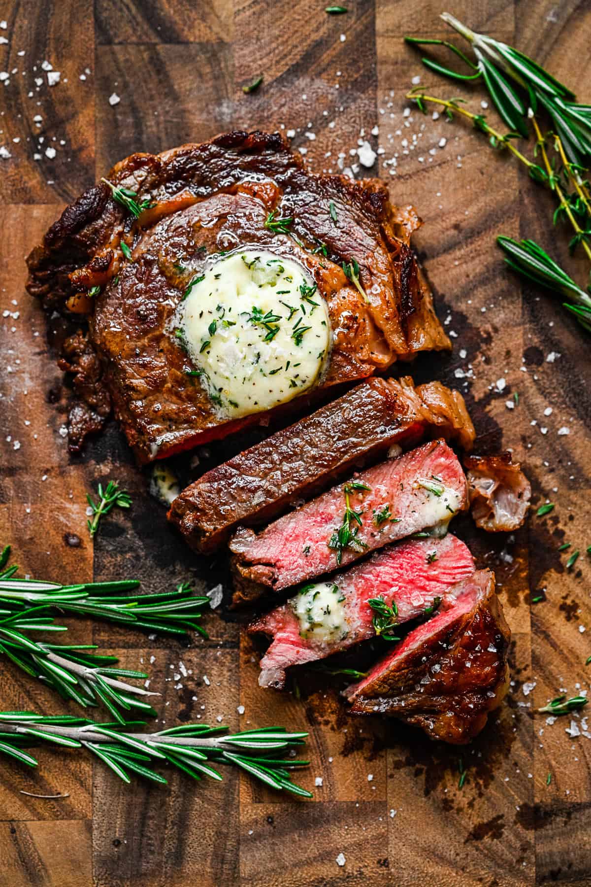 Pan Fried Ribeye sliced on a cutting board. 