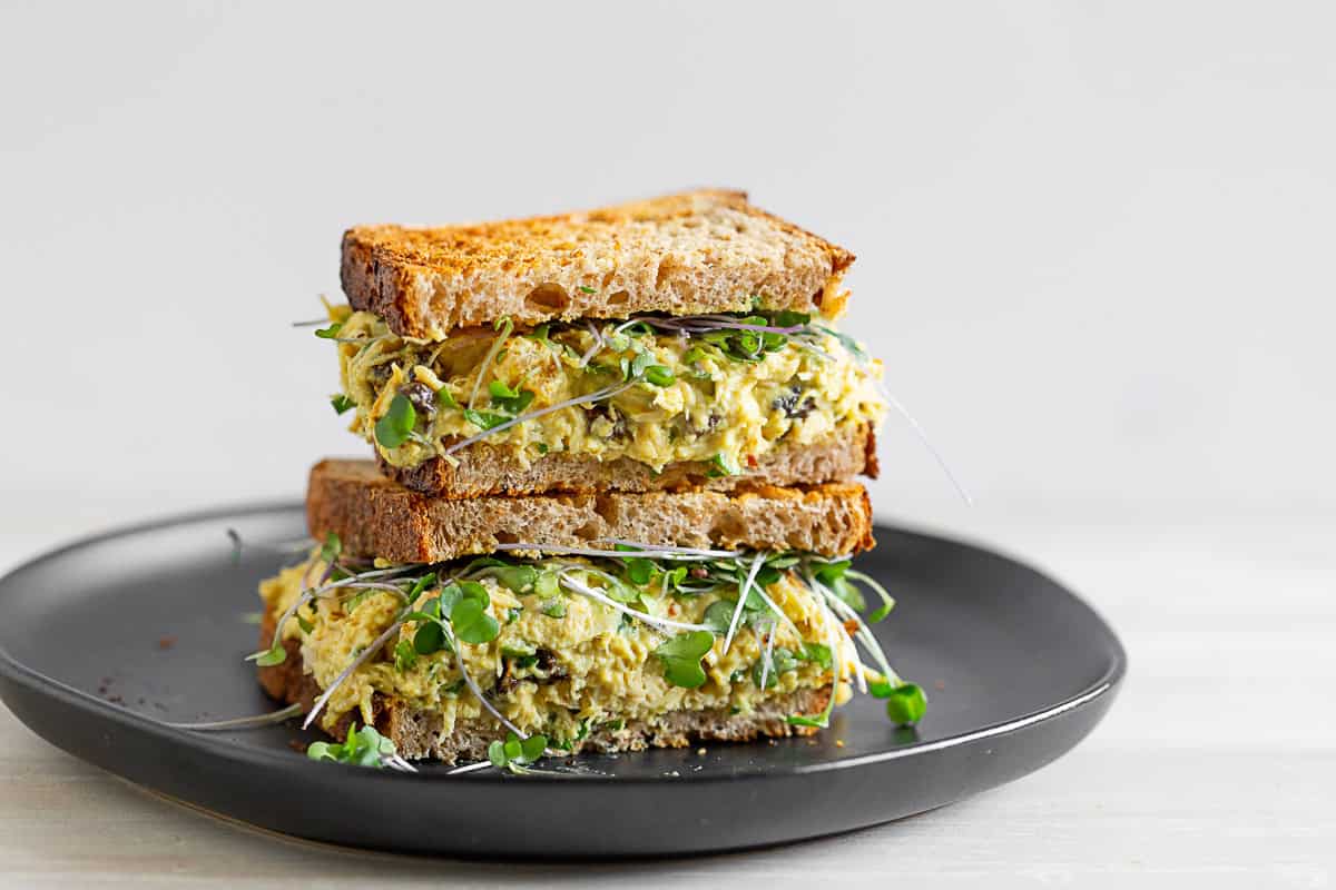 curried chicken salad on toasted bread cut in half. 