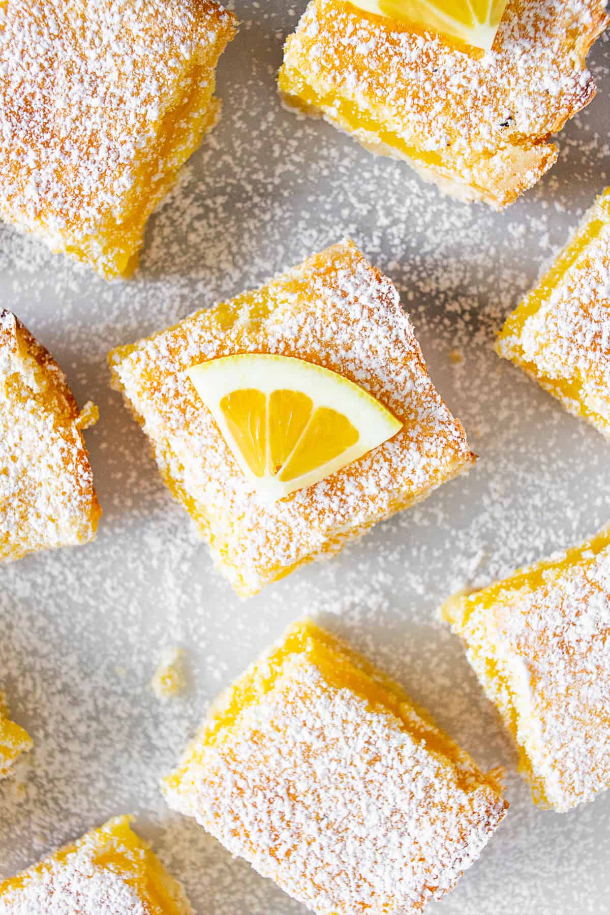 Homemade Lemon Bars on a marble board. 