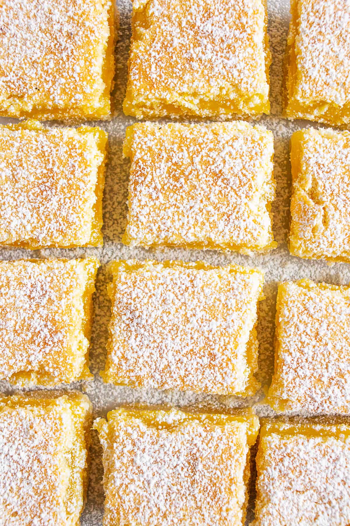Homemade Lemon Bars cut on a board. 