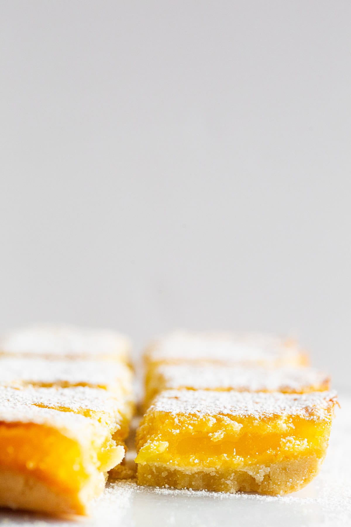Homemade Lemon Bars dusted with powdered sugar. 
