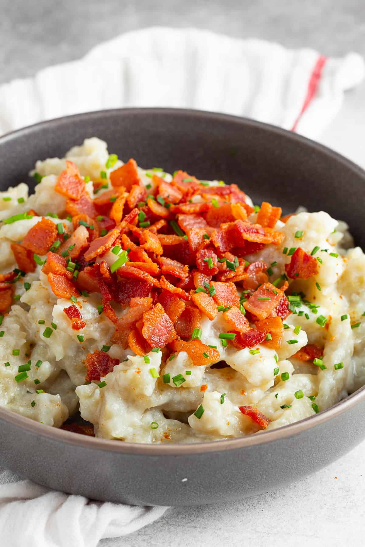 Potato Halusky (Bryndzové halušky) topped with bacon and chives. 
