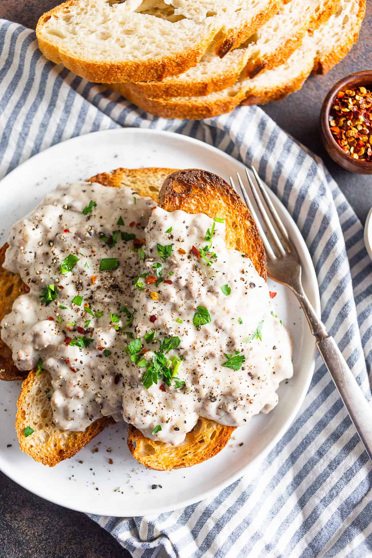 SOS Creamed Beef Recipe served with crushed red pepper for heat. 