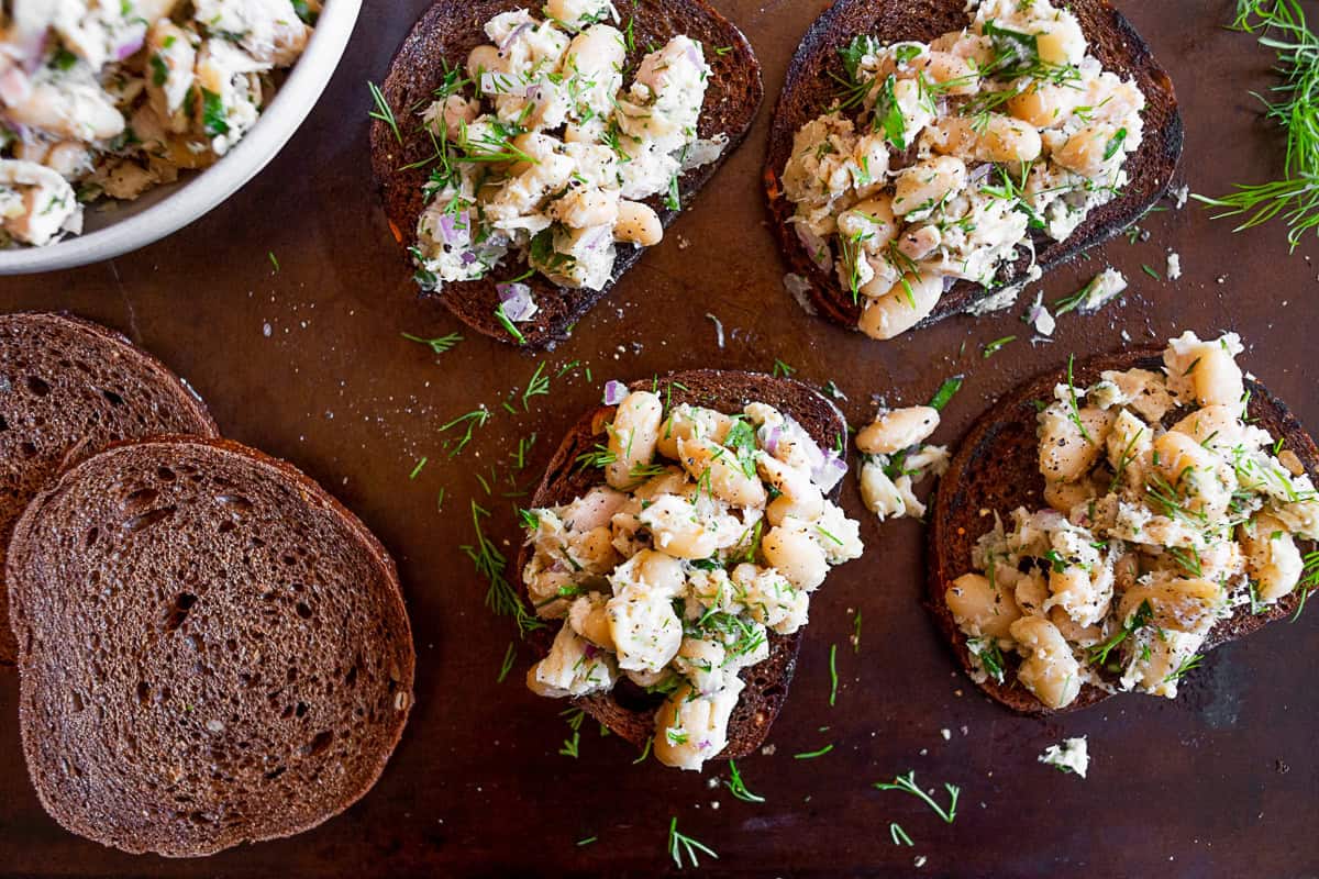 Tuna White Bean Herb Salad served on toasted bread.