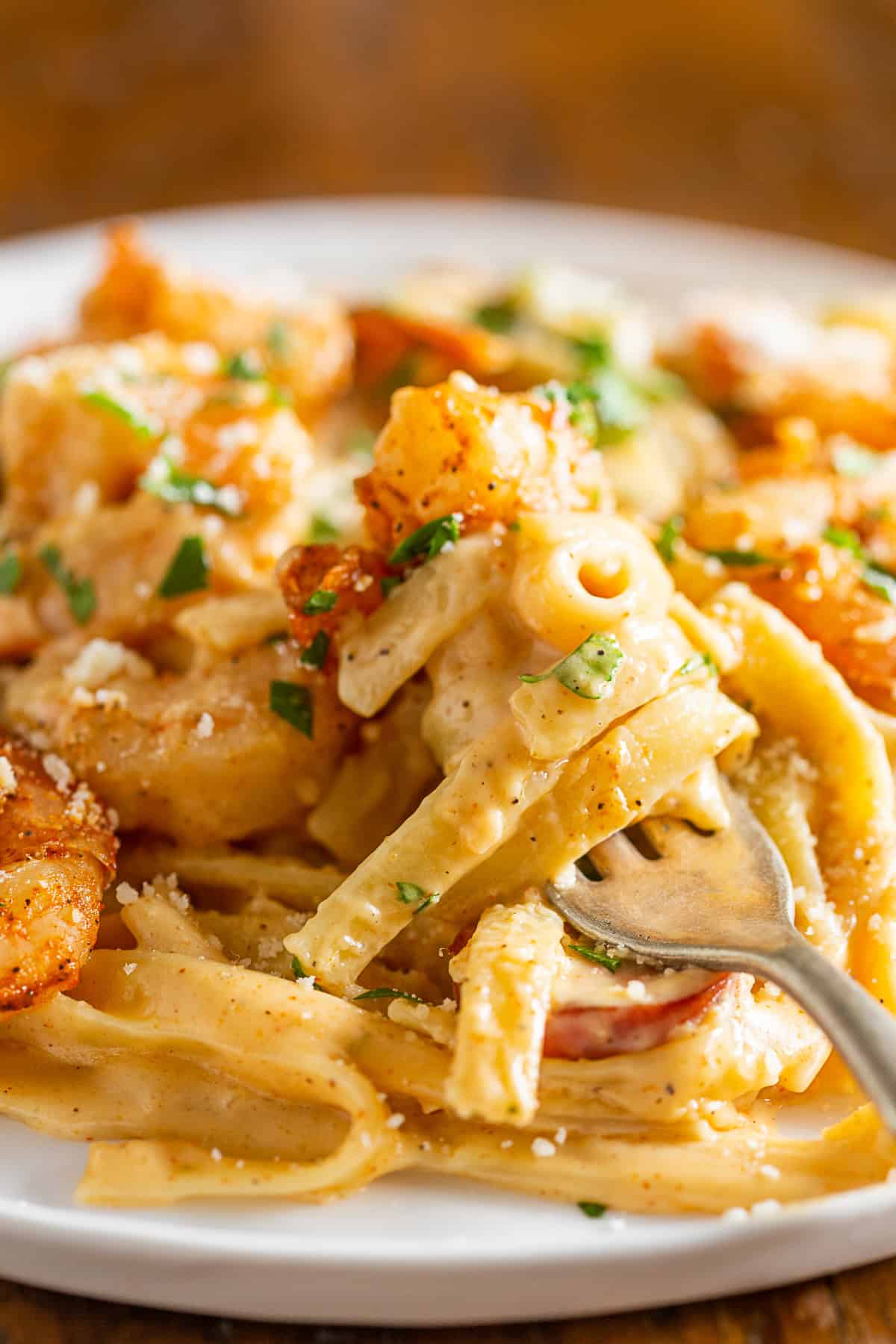 Cajun Shrimp Fettuccine Alfredo on a plate with a fork. 