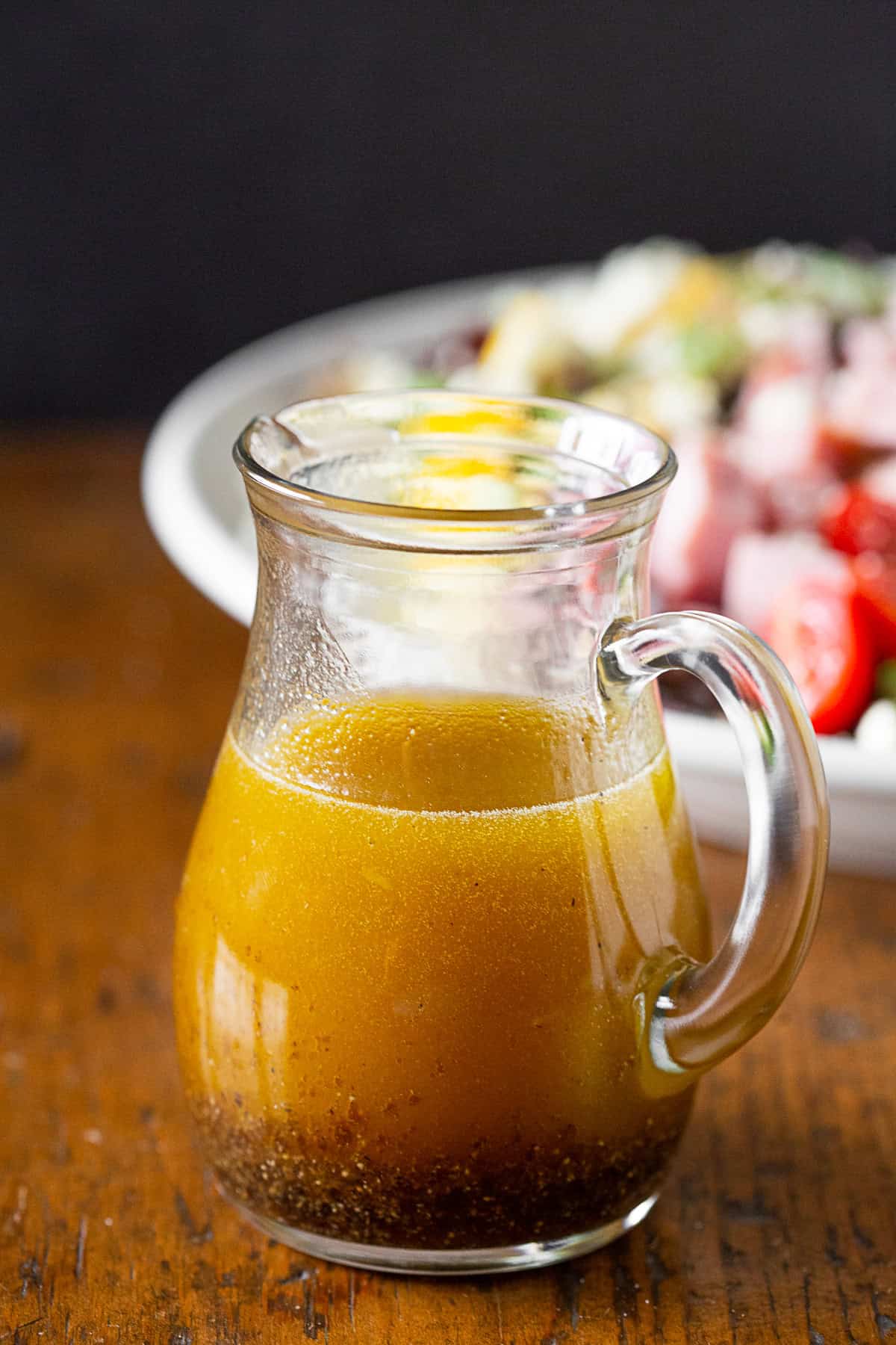 Dressing for cobb salad in a glass jar.