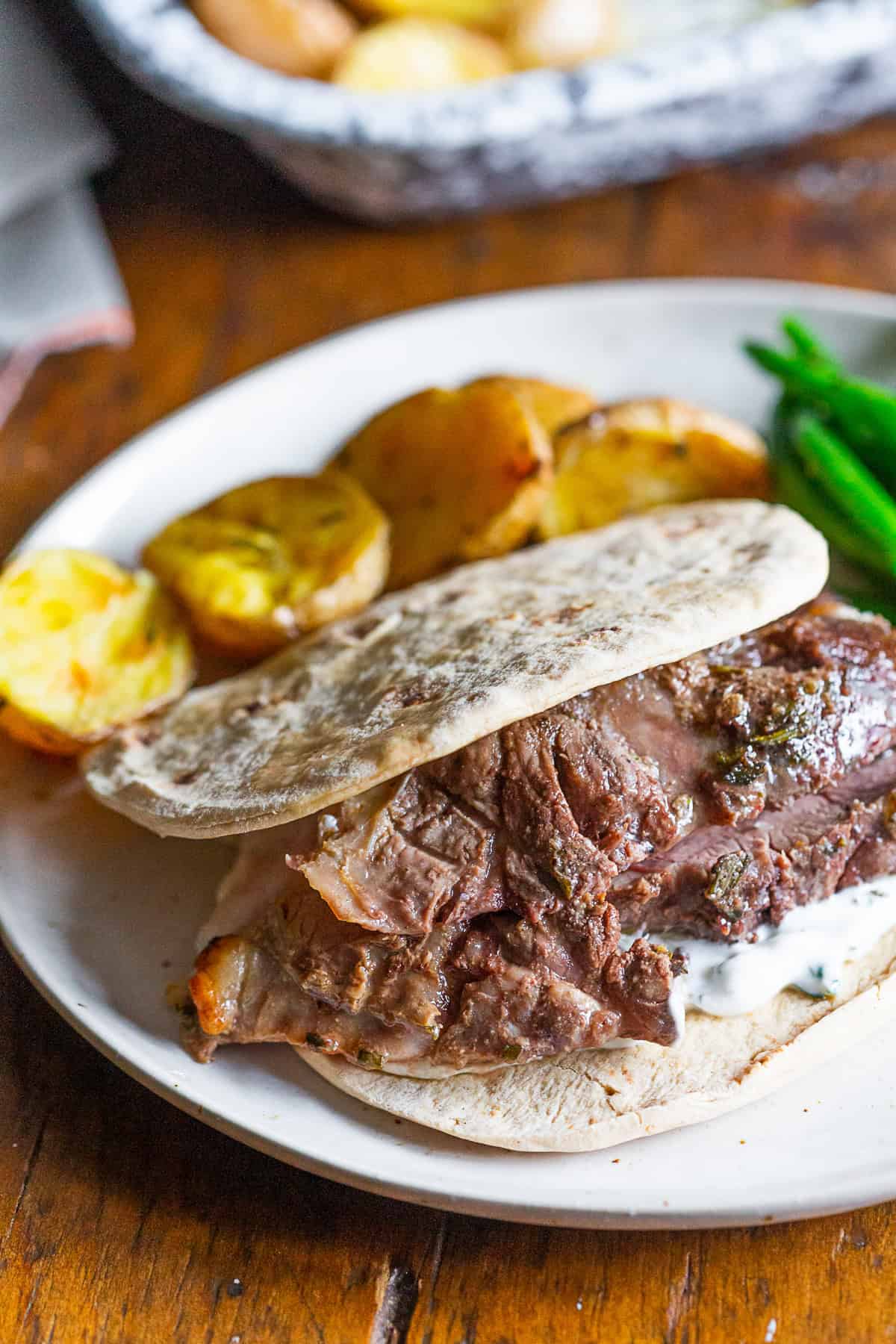 Garlic Rosemary Roast Leg of Lamb sliced in a pita. 