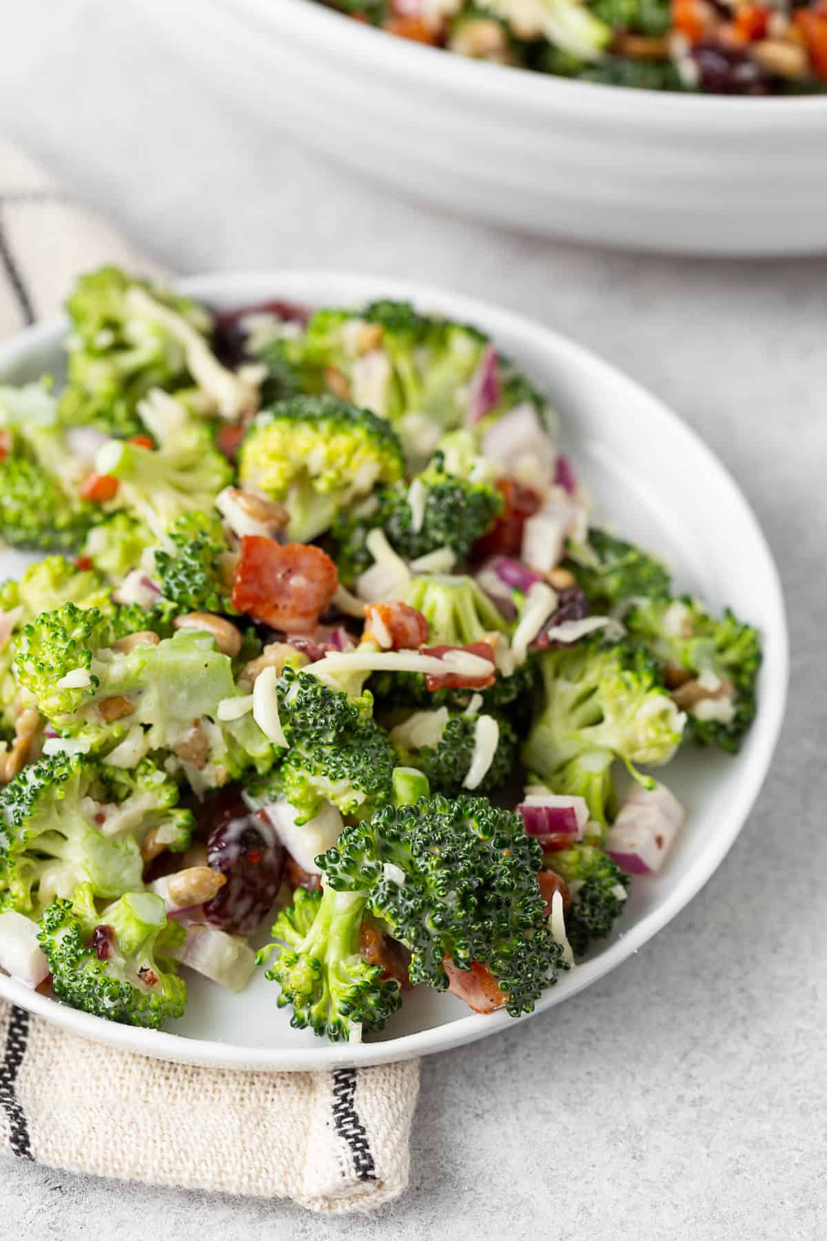 Broccoli salad on a white plate. 