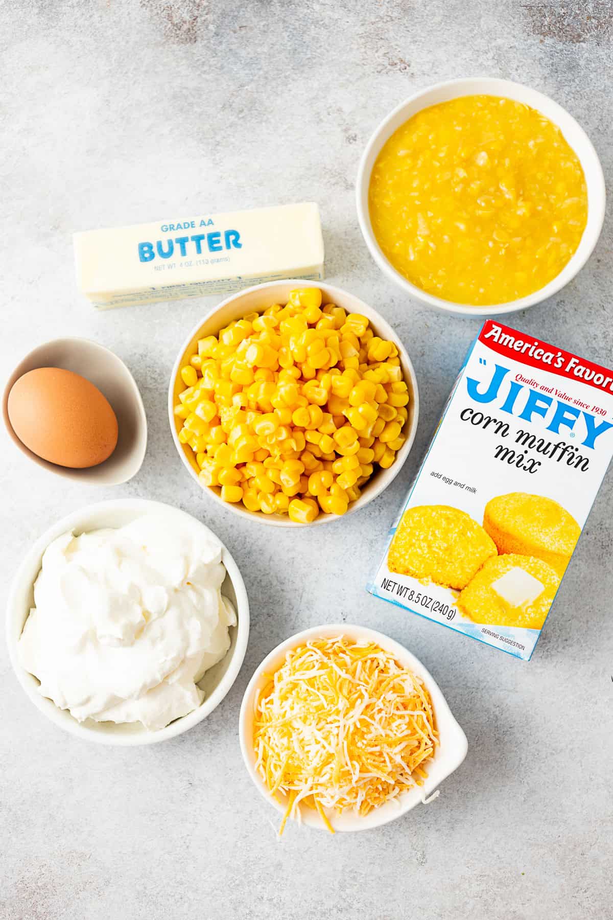 Ingredients to make Corn Casserole on a table. 