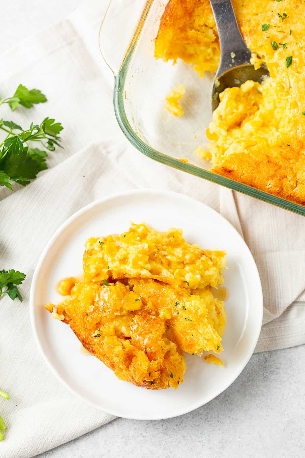 Corn Casserole scooped onto a small plate. 