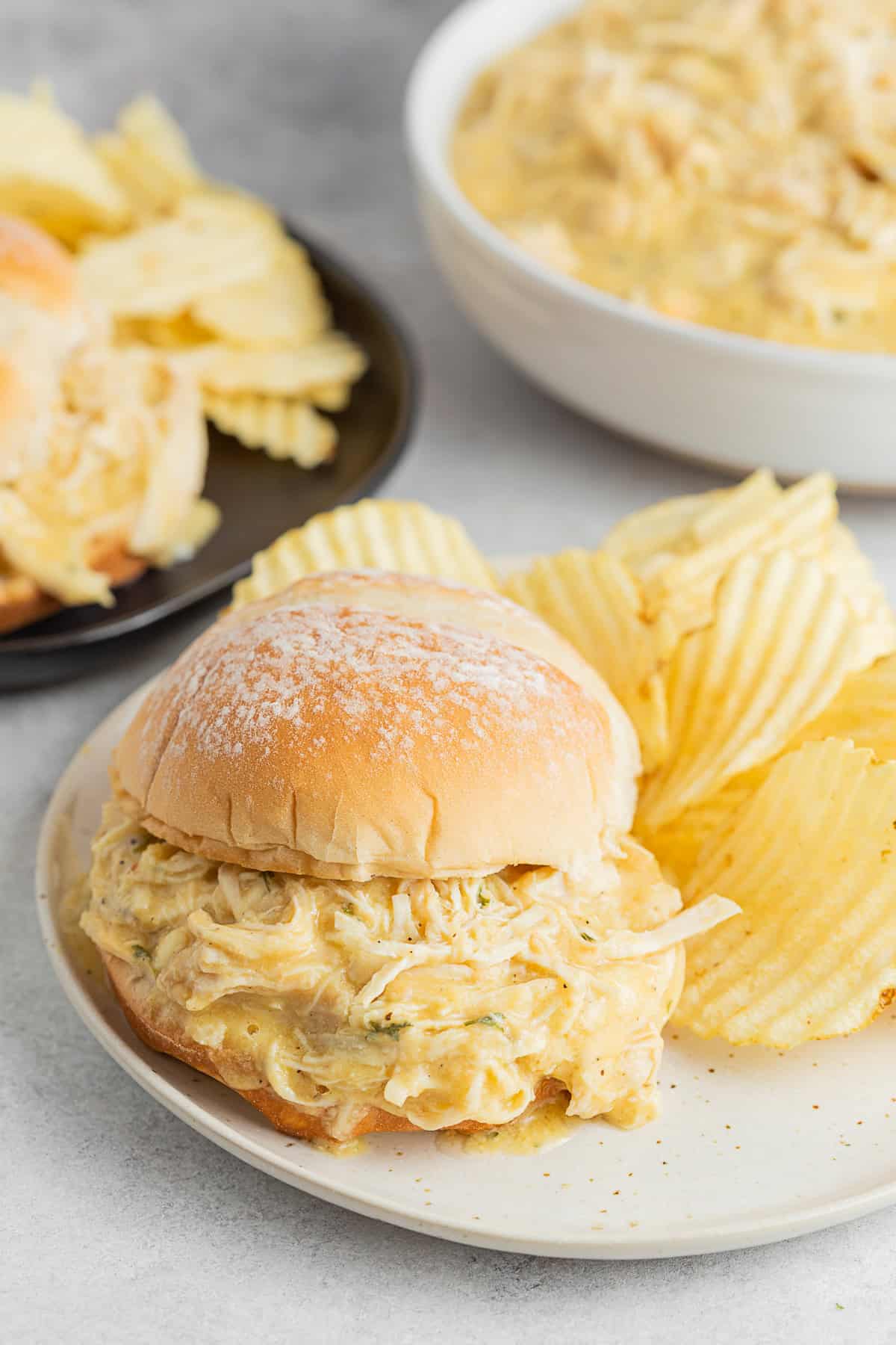 Ohio Shredded Chicken Sandwich served with chips on a plate.