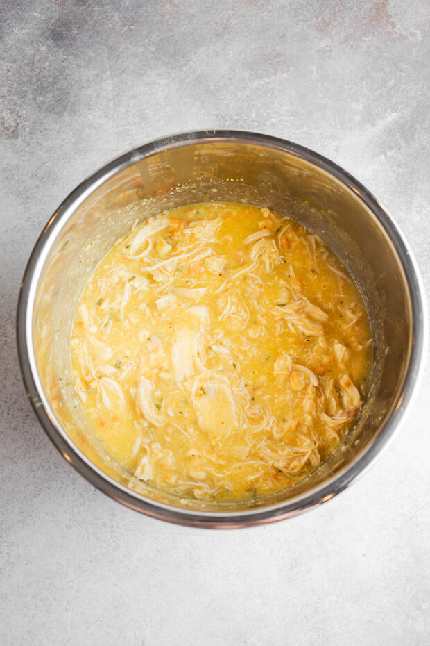 creamy shredded chicken in a pot.