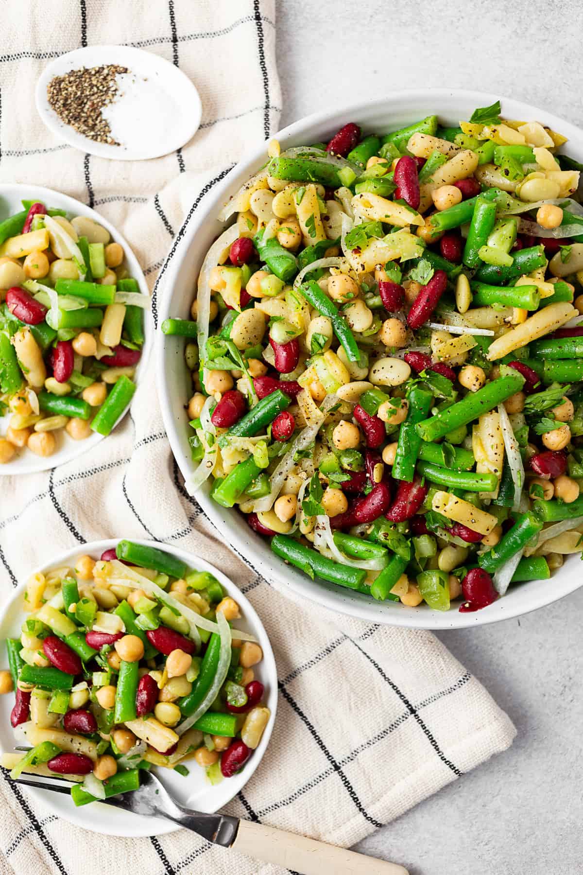 The Best 5 Bean Salad in a large bowl and on a white plate. 