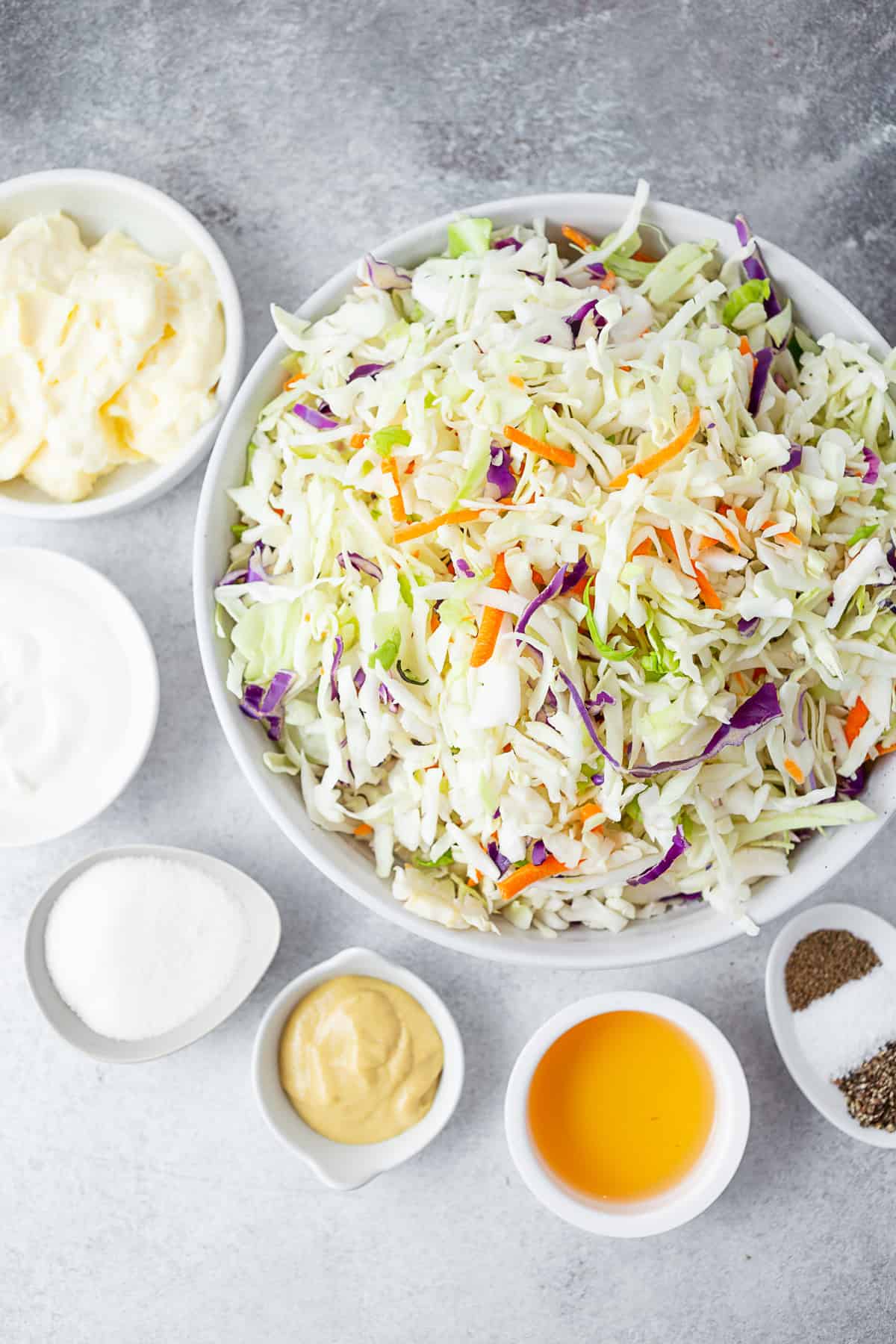 Ingredients to make Creamy Coleslaw on a table.