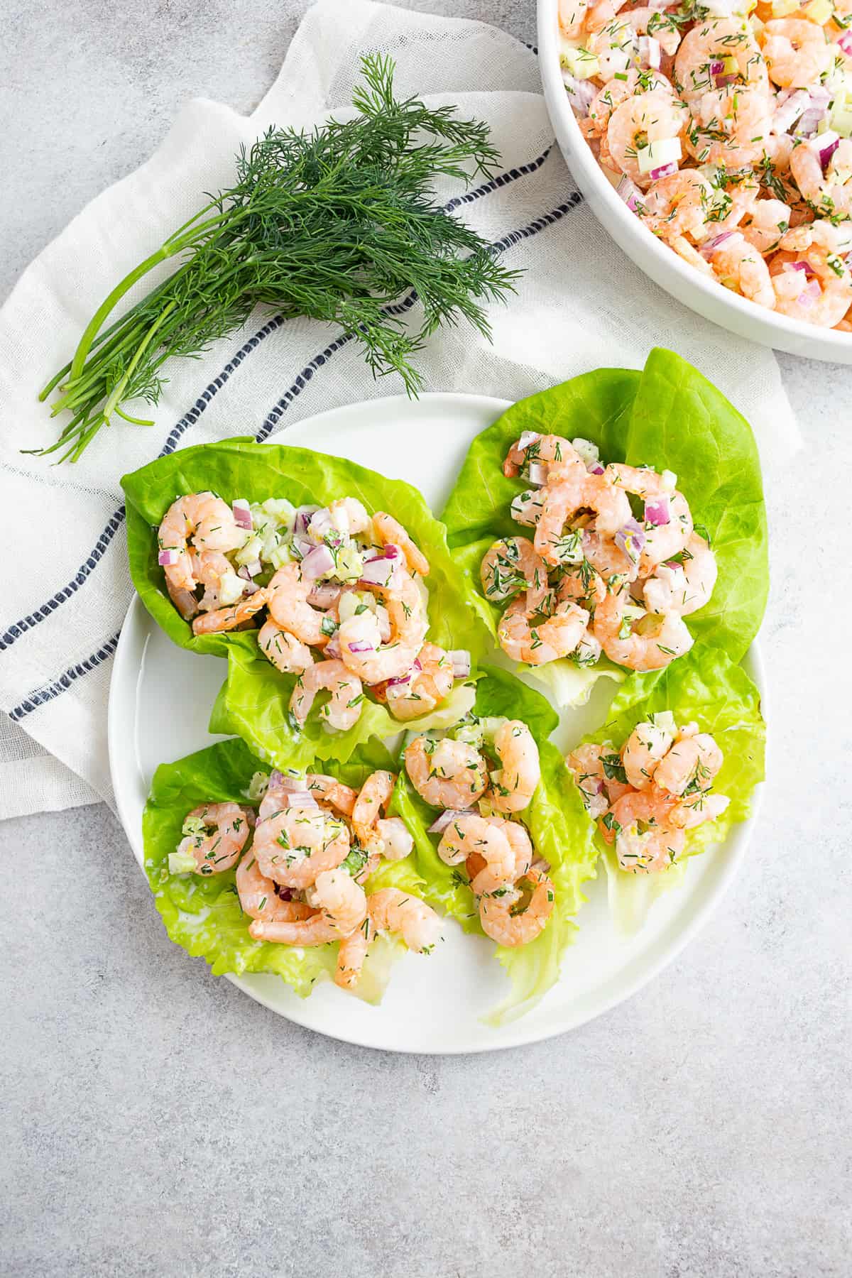 Classic Shrimp Salad on lettuce leaves on a plate.